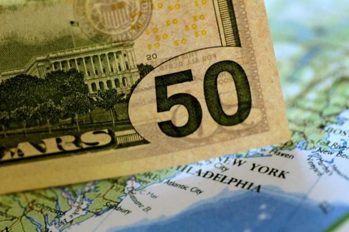 Dollar firm on strong U.S. data, outlook hopes hoist yuan to...